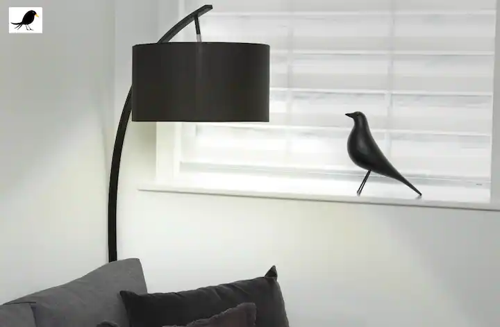 Blackbird ornament in window