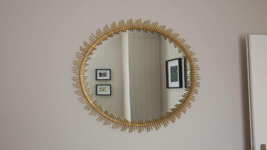 Gold circular wall mirror